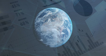 Spinning globe against statistical data processing in background. Global networking and business data technology conceptの写真素材