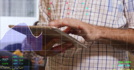 Image of data processing over caucasian businessman using tablet. Global business and digital...