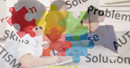 Image of colorful puzzle and autism texts over diverse children with tablets. Autism awareness month and children health concept digitally generated image.の写真素材
