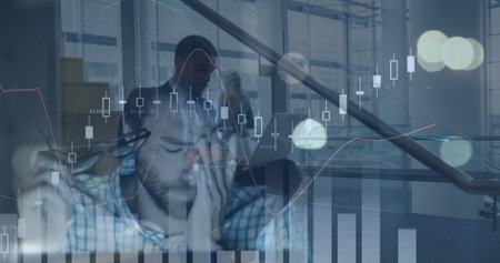 Image of financial graphs over caucasian businessman using laptop in office. Business, finance,...