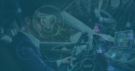Image of connections and icons over caucasian man driving car. Transport, business, finance and...