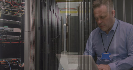 Image of data processing over caucasian server room worker. Global connections, data processing and...