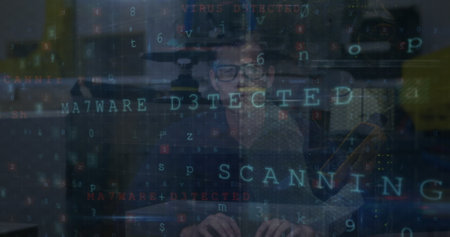 Image of cyber attack warning text and data processing over caucasian hacker. Global technology, online security and digital interface concept digitally generated image.の写真素材