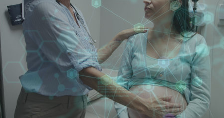 Image of data processing over caucasian female nurse with pregnant patient. Global business and digital interface concept digitally generated image.の写真素材