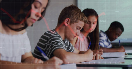 Image of graph over class of diverse pupils during lesson. School, education, learning, finance and economy concept digitally generated image.の写真素材