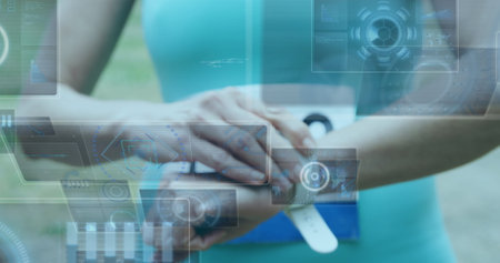 Image of data processing over sportswoman checking smartwatch. Global sport and digital interface concept digitally generated image.の写真素材