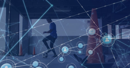Network of digital icons against african american male soccer player practicing. Global networking and sports technology conceptの写真素材