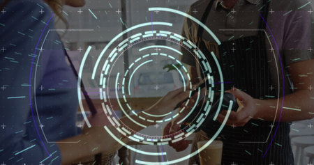 Image of processing circle over hands of caucasian people using payment terminal. Business, wireless...