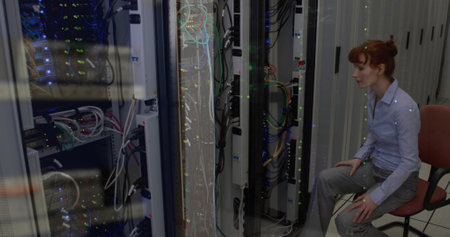 Image of data processing against caucasian female engineer working at server room. Business data...