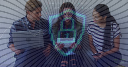 Image of digital shield with padlock over happy diverse female and male coworkers. Business, data processing, digital security, connections and technology concept digitally generated image,の写真素材