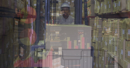 Image of financial data over male warehouse worker. Business, finance, technology and delivery services concept digitally generated image.の写真素材