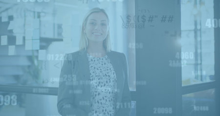 Image of data processing over caucasian businesswoman using smartphone in office. Global business and digital interface concept digitally generated image.の写真素材