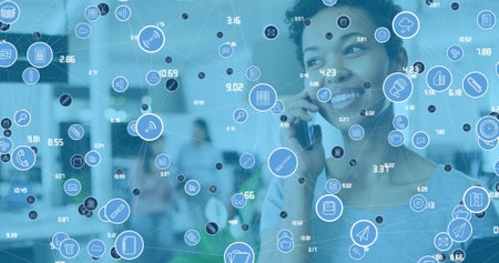 Image of data processing over african american businesswoman using smartphone in office. Global...