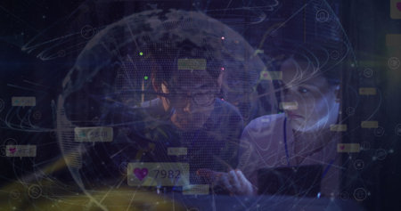 Image of globe and icons over diverse couple of server room workers. Cloud computing concept...