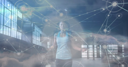 Image of network of connections over clouds and fit afrcian american woman jumping. Sport, active...