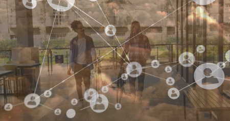 Image of network of connections and sky with clouds over african american men walking with bikes. Global connections, sport and digital interface concept digitally generated image.の写真素材