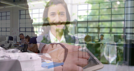 Image of person caucasian man using tablet over smiling caucasian woman. Global business, finances, data processing and digital interface concept digitally generated image.の写真素材