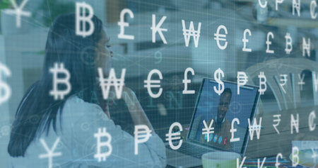 Image of data processing and currency symbols over woman using laptop. Global business and digital...