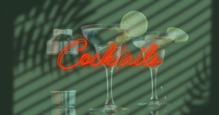 Image of red neon cocktail text over shadows on cocktails. Abstract concept digitally generated image.の写真素材