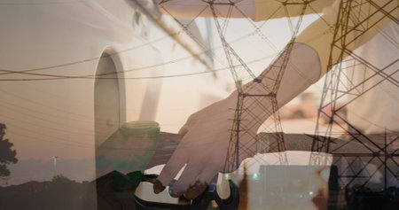 Image of electricity poles over hands of caucasian woman refueling car. Energy, oil and transport...