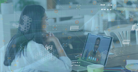 Image of icons and dna over woman having image call on laptop. Business, finance, economy and...