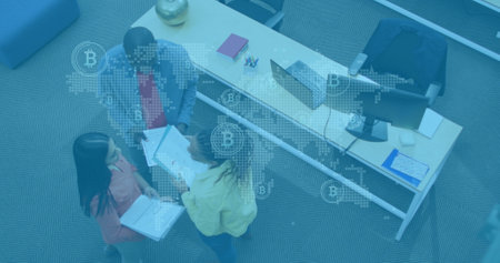 Image of world map with network icons over diverse business people in office. Global business and digital interface concept digitally generated image.の写真素材