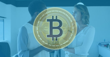 Image of bitcoin symbol over diverse business people in office. Global business and digital interface concept digitally generated image.の写真素材