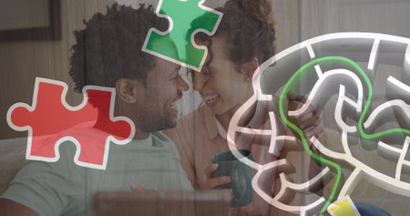 Image of colourful puzzle over couple with tablet. Autism awareness month and celebration concept...