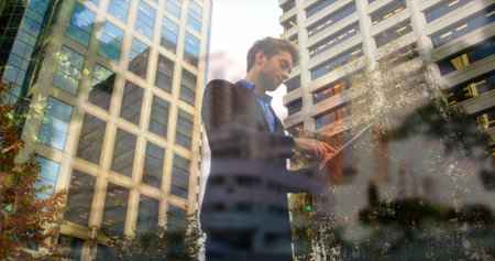 Image of timelapse with walking people over caucasian businessman using tablet. Business, lifestyle...