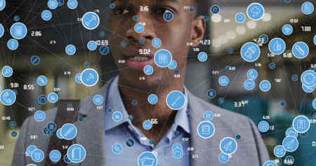 Image of media icons over african american businessman in office. Global business and digital interface concept digitally generated image.の写真素材