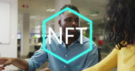 Image of nft over diverse female and male coworkers in office. Digital resources, business and technology concept digitally generated image.の写真素材