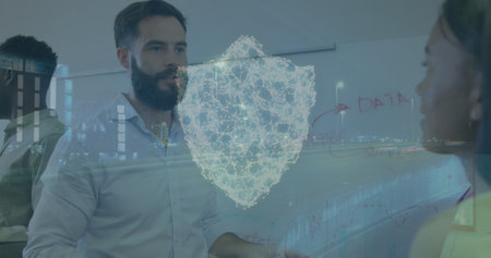 Image of cityscape with shield icon over diverse business people in office. Global business,...
