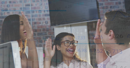 Image of data processing over diverse business people high fiving. Global business and digital interface concept digitally generated image.の写真素材