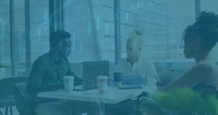 Image of financial data and graphs over diverse coworkers in office. Business, finance and economy...