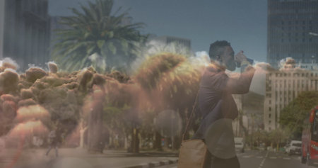 Image of clouds over african american businessman walking. Global business and digital interface concept digitally generated image.の写真素材