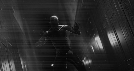 Image of black and white scratched film of scary figure in dark corridor holding head in pain. Halloween, fear, horror and suspense concept digitally generated image.の写真素材
