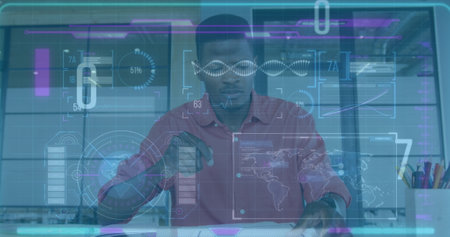Image of digital screen over afrcian american man in office. Business, finance, economy, data...