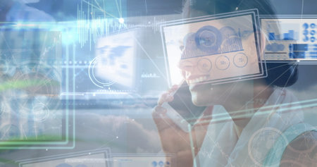 Image of data processing over caucasian businesswoman talking on smartphone. Global business and...