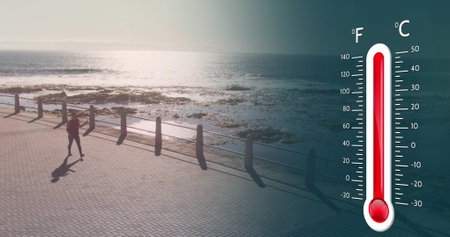 Image of digital thermometer over sea landscape. Global technology, computing and digital interface concept digitally generated image.の写真素材