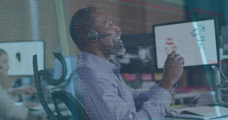 Image of data processing over african american senior man talking on phone headset at office. Computer interface and business technology conceptの写真素材