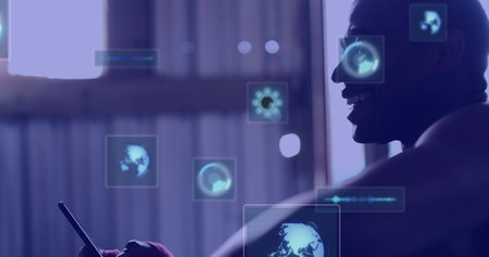 Image of digital screens with data over hands of african american man using smartphone. Data processing, digital interface and technology concept digitally generated image.の写真素材