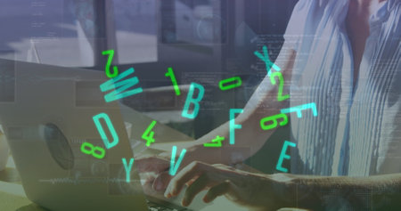 Image of numbers and letters over caucasian woman using laptop. Global business, data processing and digital interface concept digitally generated image.の写真素材