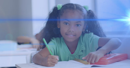 Image of light trails over african american schoolgirl. Global education and learning concept...