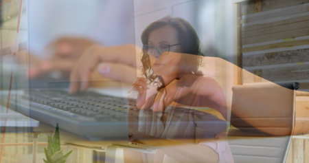 Image of hands using computers over caucasian businesswoman in office. Global business and digital...