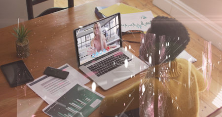 Image of connections and shapes over african american woman having image call on laptop. Business,...