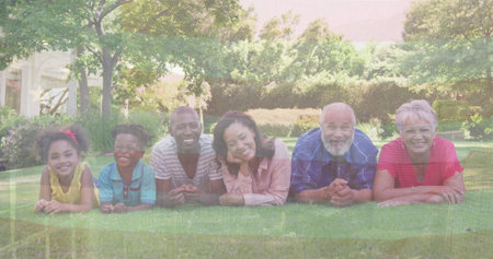 Image of flag of usa over african american family in garden. Global patriotism and digital interface...