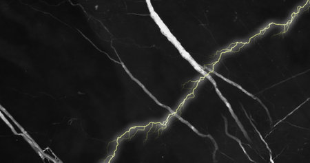 Image of yellow and white bolts of lightning in night sky. Nature, power, energy and change, abstract background concept digitally generated image.の写真素材