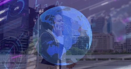 Image of globe and data processing over african american businesswoman talking on smartphone. Global...