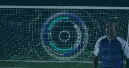 Image of scope scanning and data processing over football player on pitch. Sports, competition and data processing concept digitally generated image.の写真素材