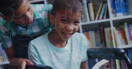 Image of graph moving over boy standing by friend reading book on wheelchair in library. Multiple...